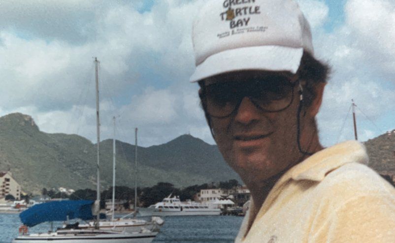 a man wearing a hat that says green turtle bay