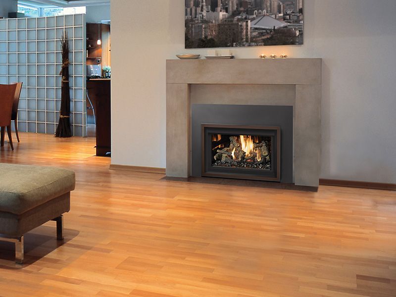 A living room with hardwood floors and a fireplace