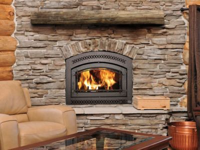 A living room with a fireplace and a coffee table