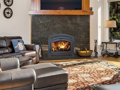A living room with a fireplace and a flat screen tv.
