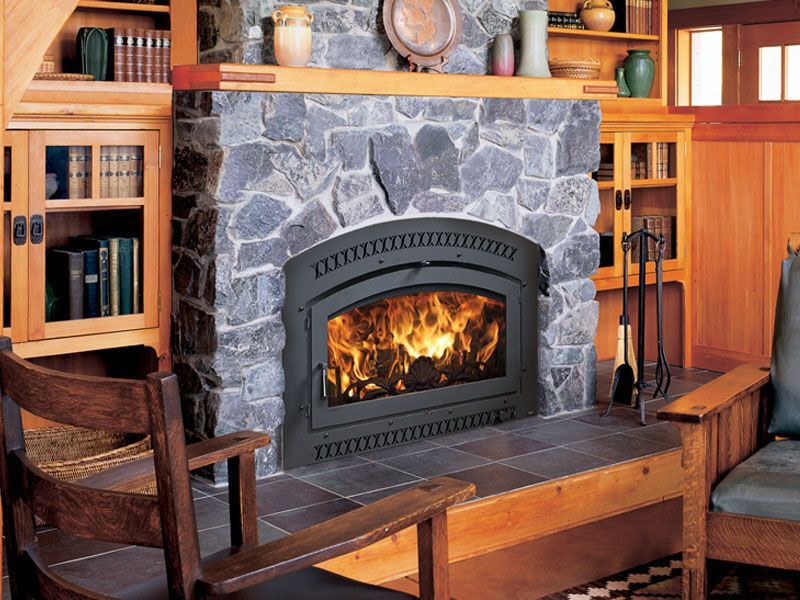 A living room with a fireplace and a chair