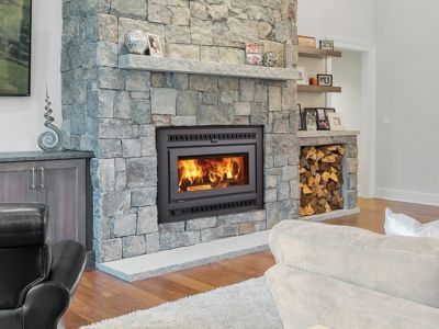 A living room with a fireplace and a couch.