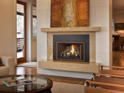 There is a fireplace in the middle of the living room.