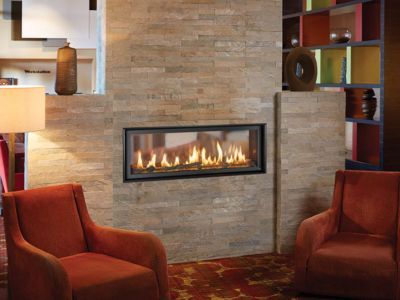 A living room with two chairs and a fireplace