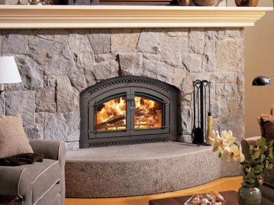 A living room with a fireplace and a chair
