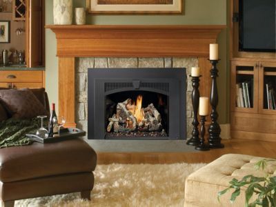 A living room with a fireplace and a couch
