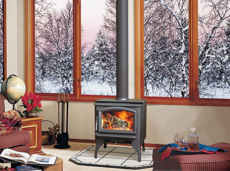 A living room with a wood stove and a globe