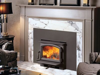 A living room with a fireplace and a wood stove