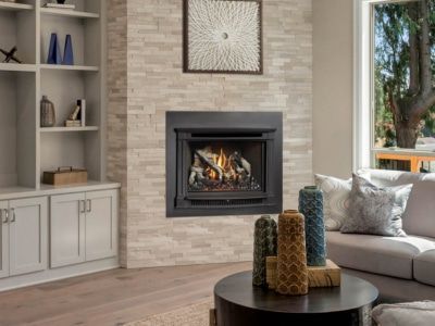 A living room with a fireplace and a couch.