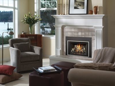 A living room with a fireplace and two chairs
