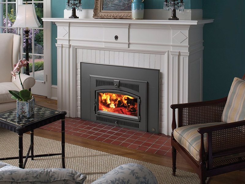 A living room with a fireplace and a chair