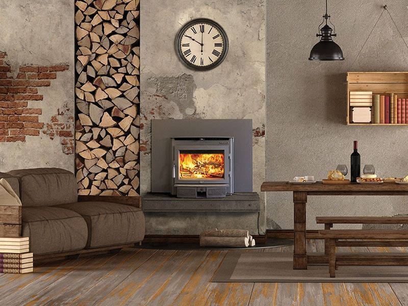 A living room with a fireplace and a clock on the wall