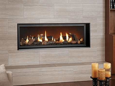 A fireplace with candles in front of it in a living room