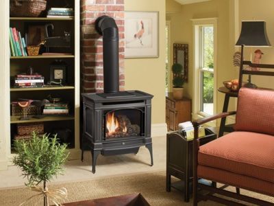 A living room with a stove and a couch