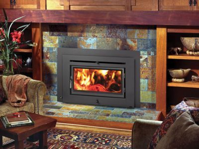 A living room with a fireplace and a couch