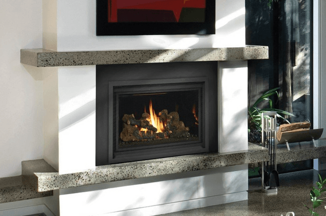 A fireplace with a painting on the wall above it