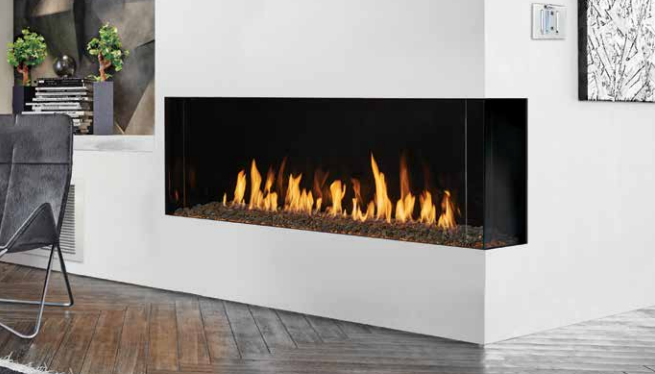 A living room with a fireplace and a chair.