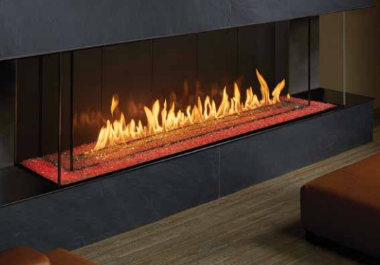 A fireplace with flames coming out of it in a living room.