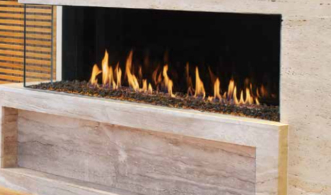 A fireplace with flames coming out of it in a living room.