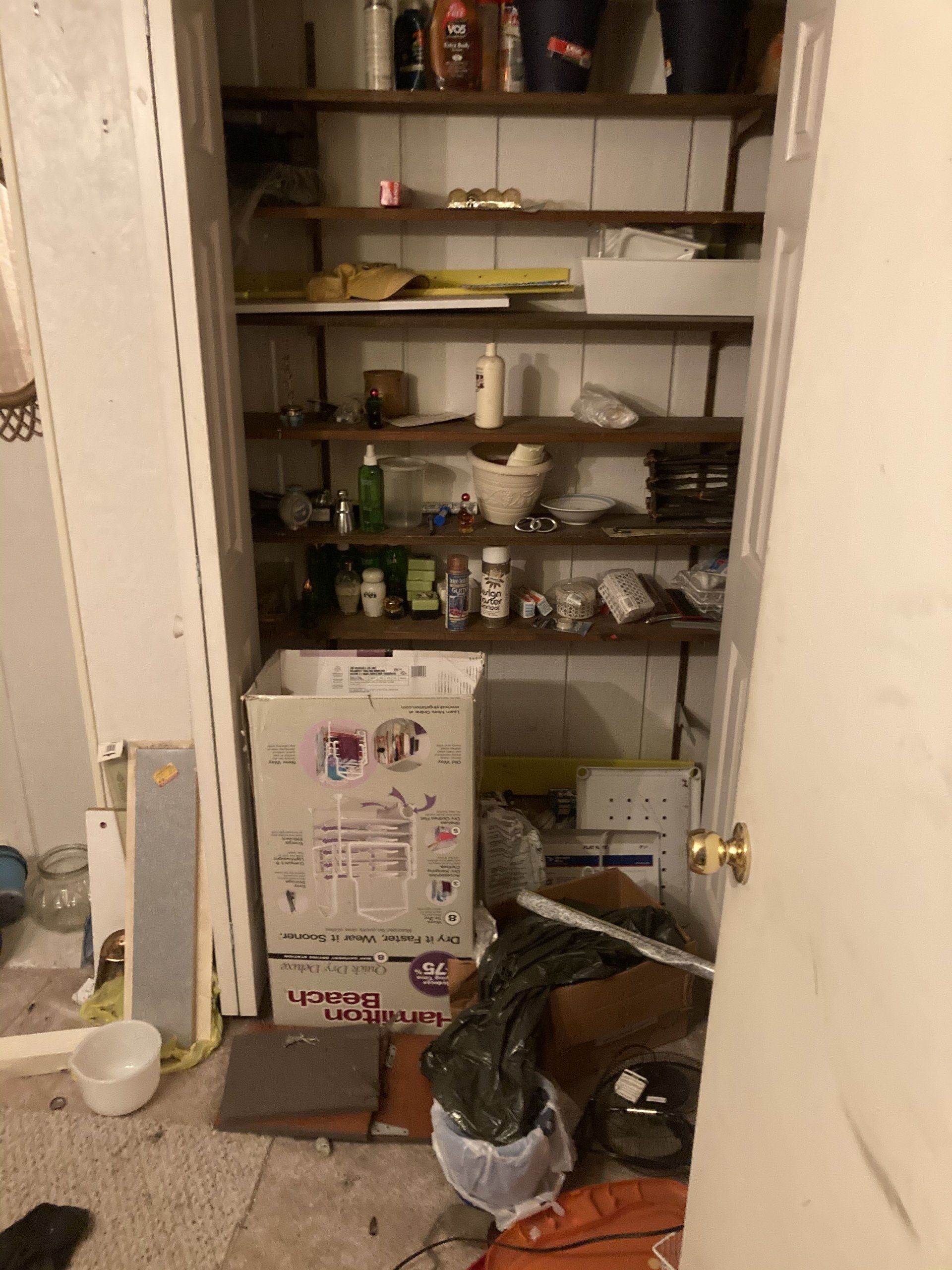 A closet filled with lots of boxes and bottles