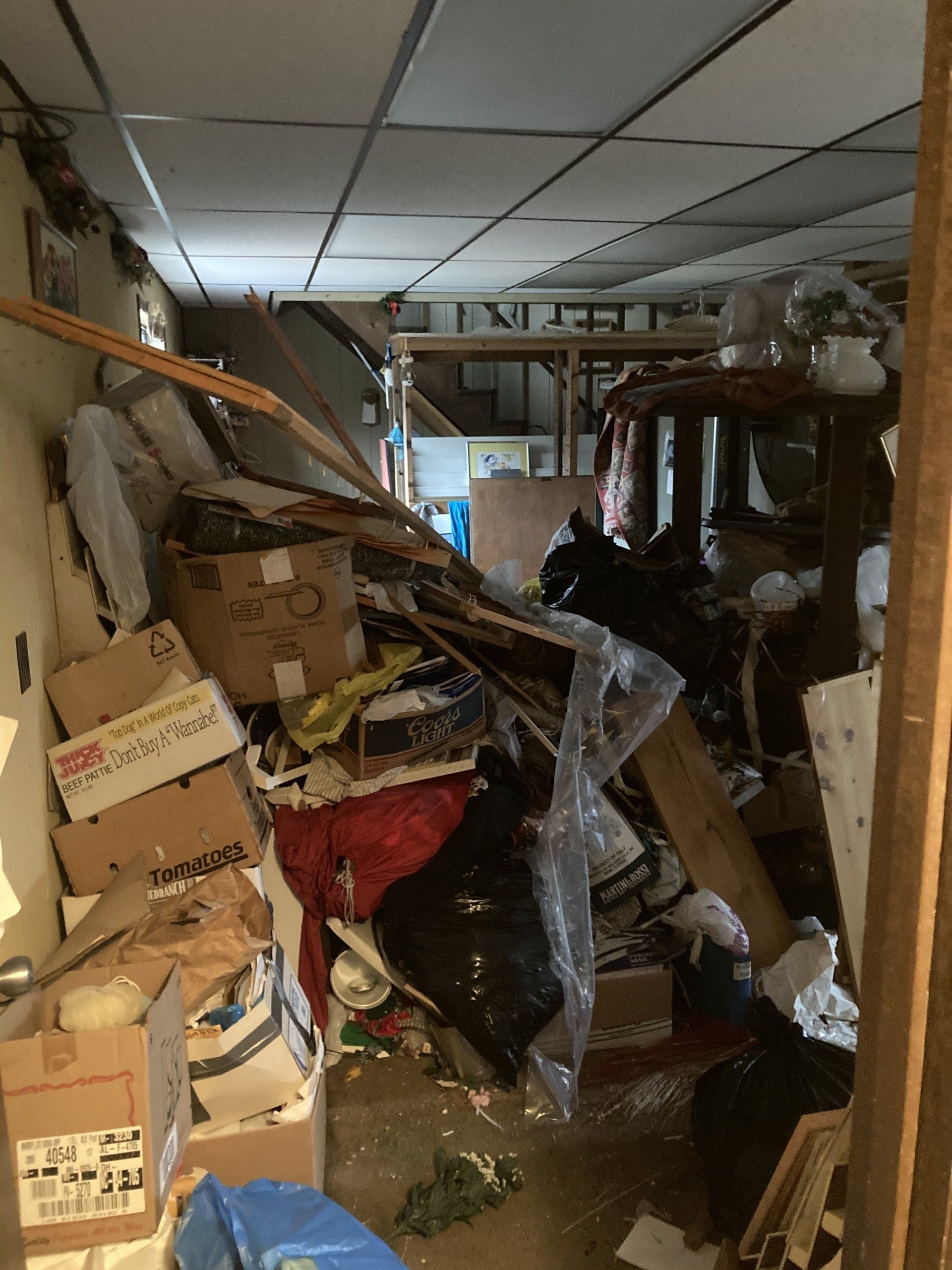 A room with a lot of boxes including one that says ' abercrombie ' on it