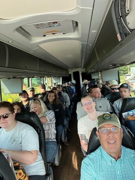 group of people on a group tour bus