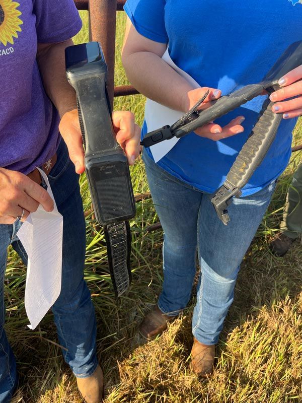closeup of people holding tools used to test soil