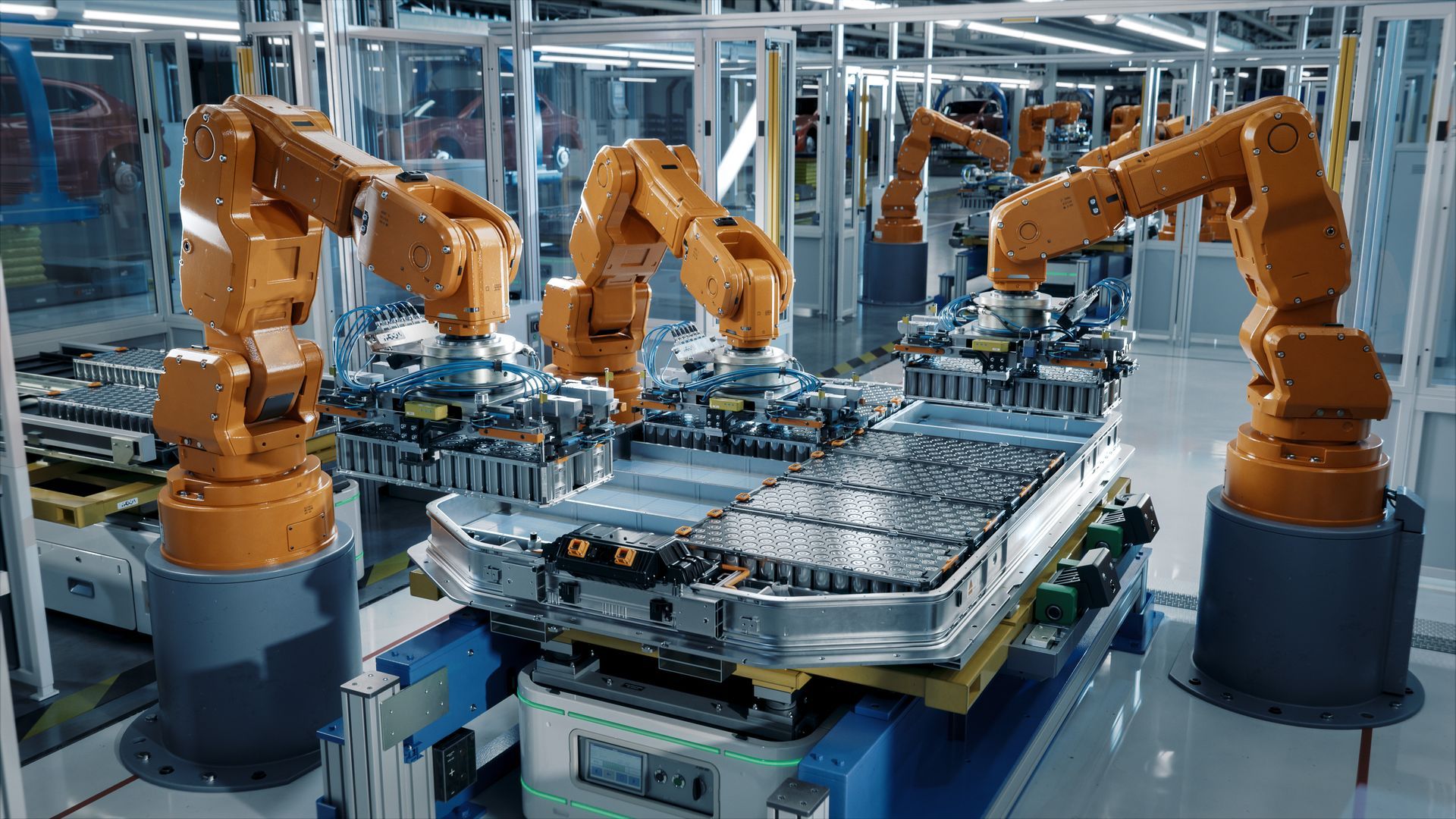 Robotic arms assembling car parts on a factory production line