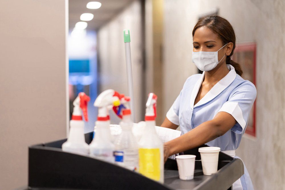 Female Worker Preparing The Cleaning Equipment - Houston, TX - All Premiere Service Solutions Female Worker Preparing The Cleaning Equipment - Houston, TX - All Premiere Service Solutions