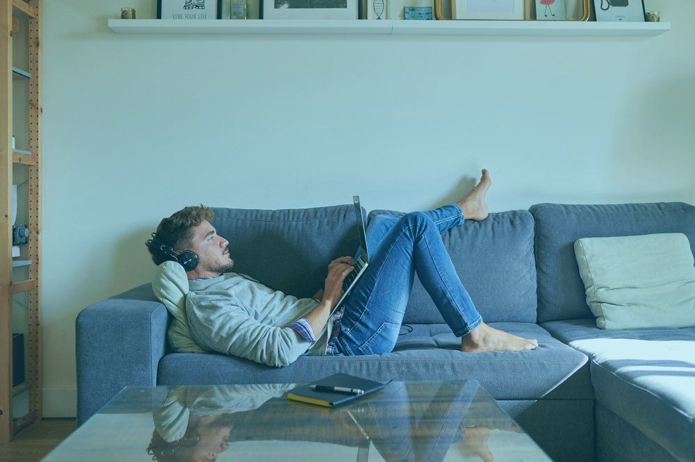 Man Relaxing On A Couch - Houston, TX - All Premiere Service Solutions