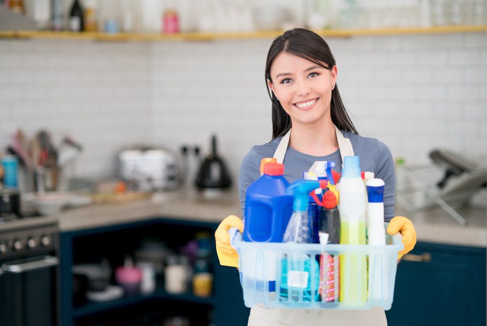 Female Worker Holding The Cleaning Products - Houston, TX - All Premiere Service Solutions Female Worker Holding The Cleaning Products - Houston, TX - All Premiere Service Solutions