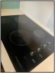 A black stove top oven is sitting on top of a counter.