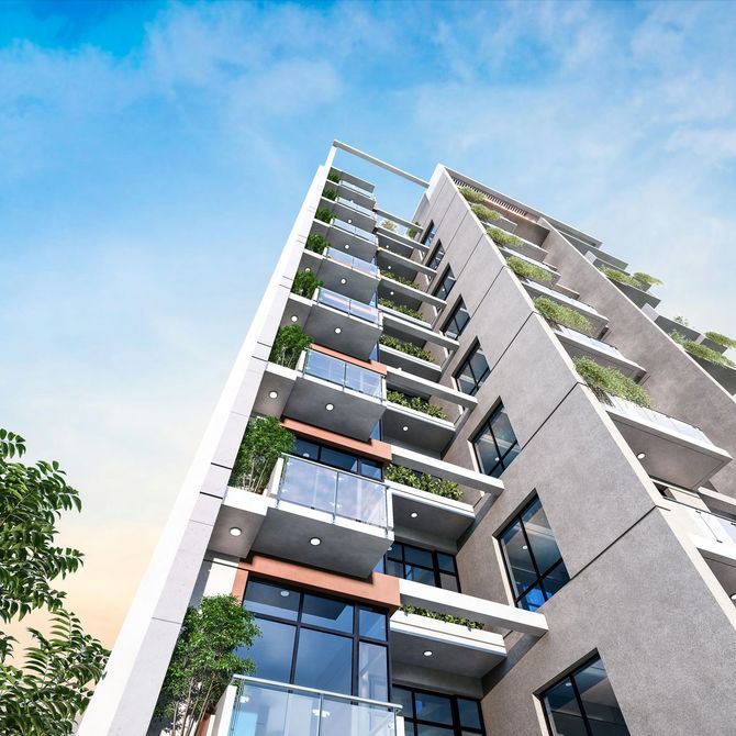 Modern apartment building with balconies and glass windows against a blue sky
