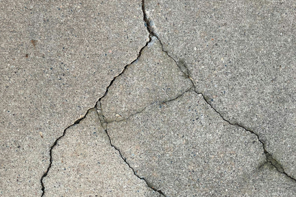 Crack in concrete that needs repair.