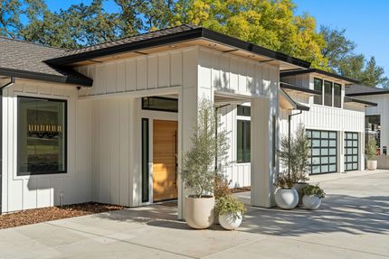 Front patio with concrete slabs as walkway and driveway.