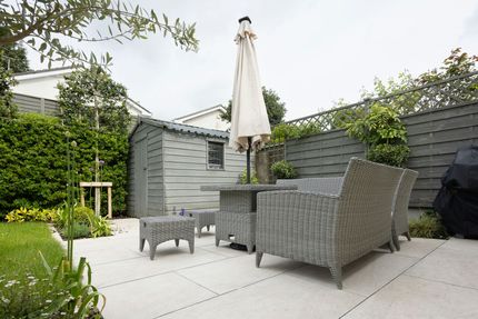 Backyard patio with concrete slabs.