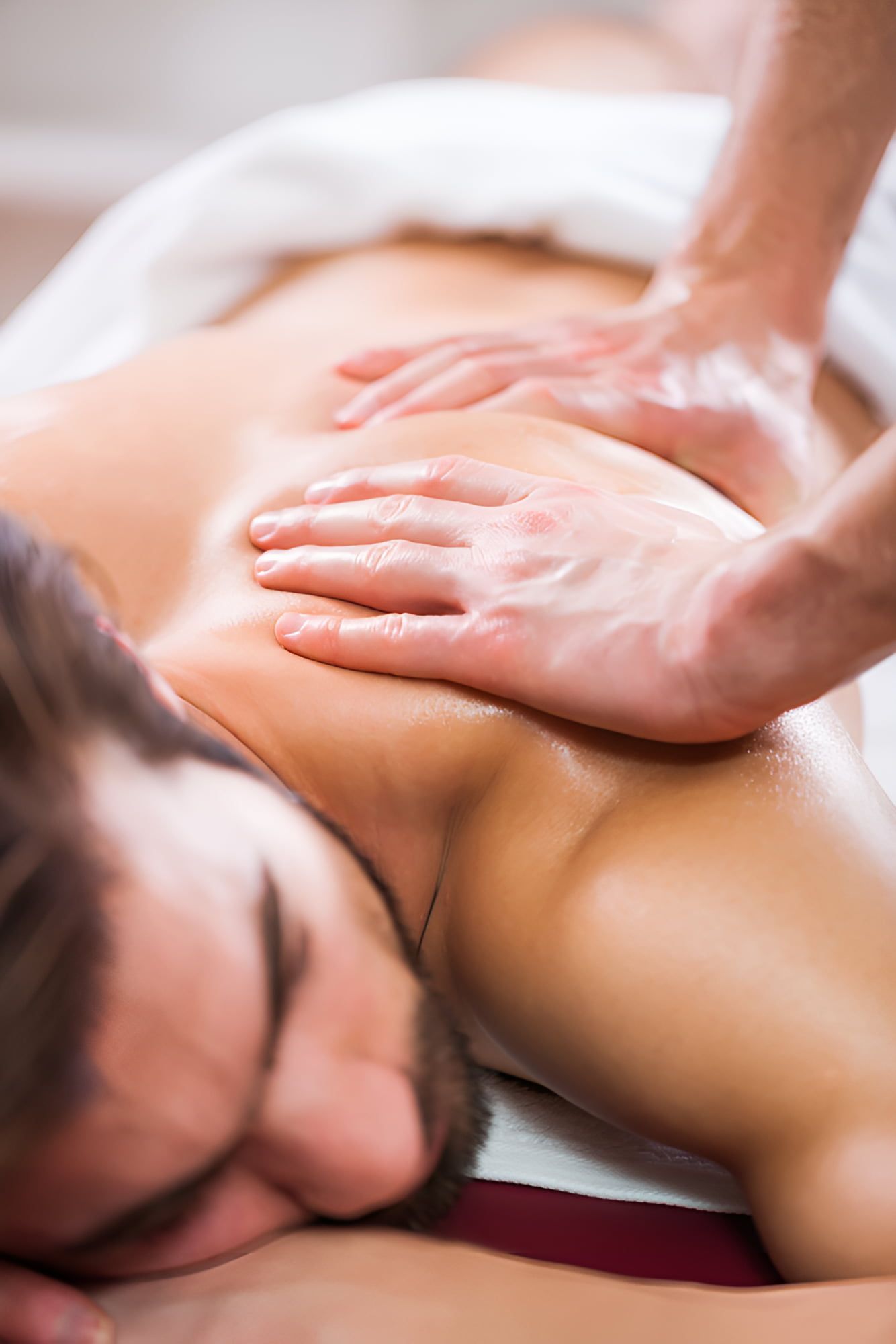 A Man Is Getting A Massage At A Spa — Back In Motion Chiropractic & Healthcare In Babinda, QLD
