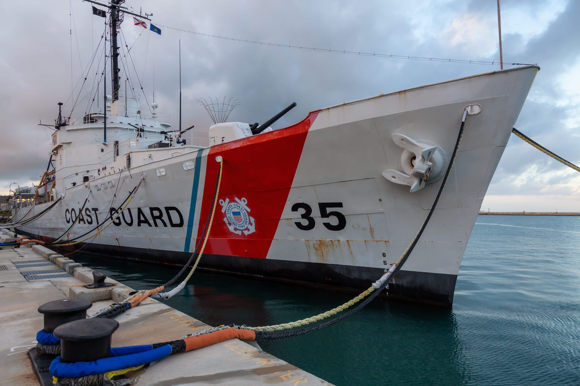 A white U.S. Coast Guard cutter, marked with