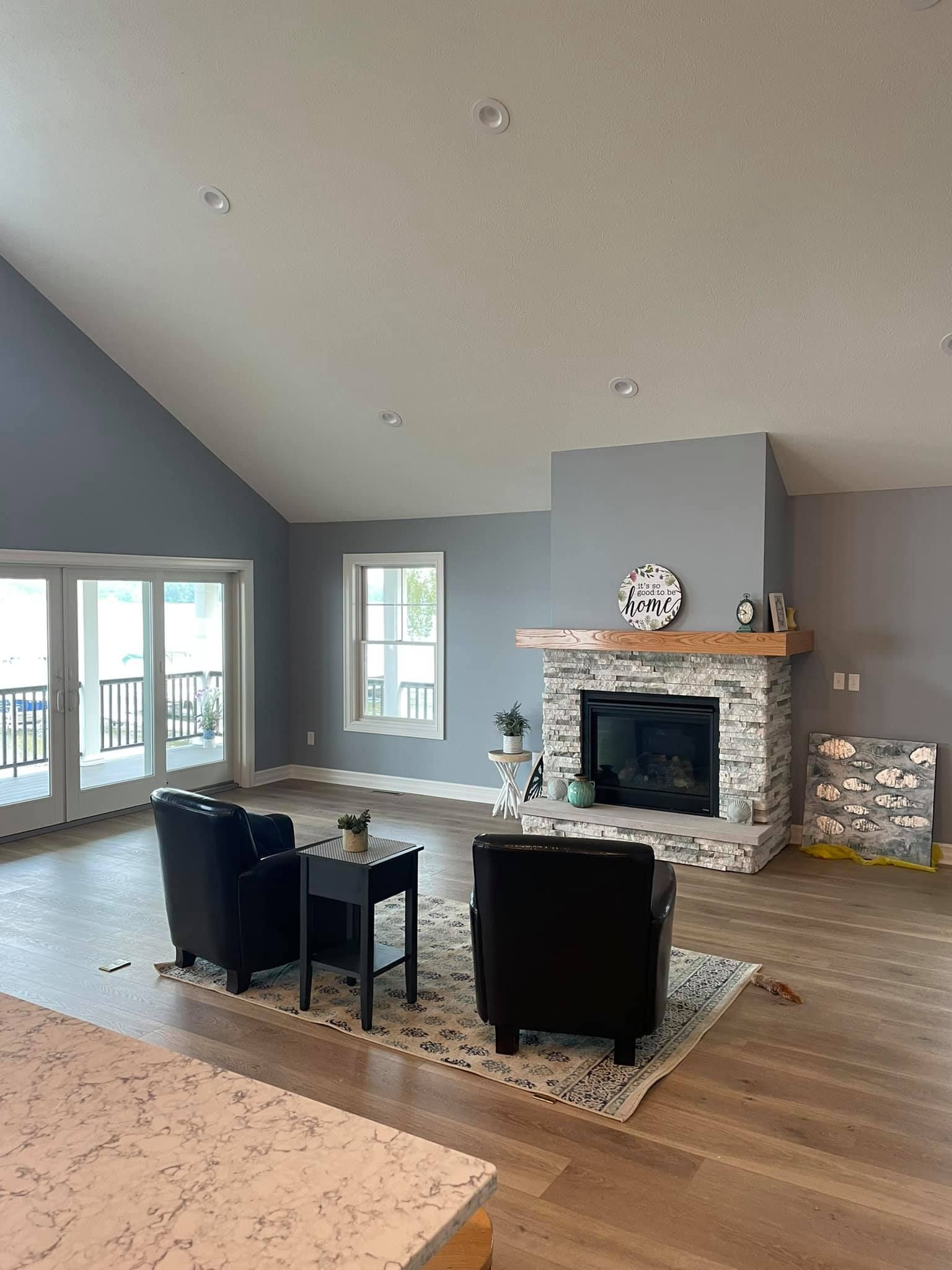 There is a fireplace in the middle of the living room.