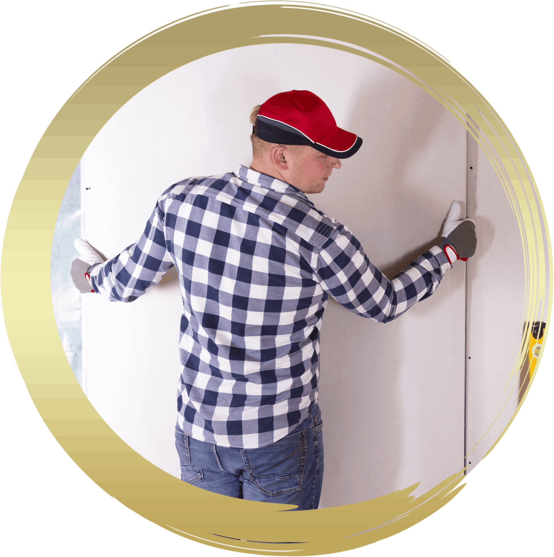 a man in a plaid shirt and red hat is plastering a wall