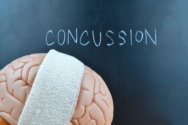 A chalkboard with the word concussion written on it