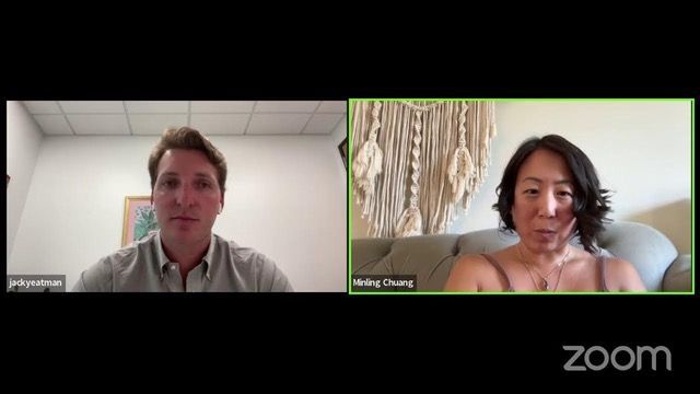 Two people in a Zoom meeting; a man on the left and a woman on the right, both looking at the camera.