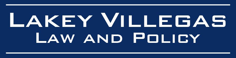 A blue sign that says lakey villegas law and policy