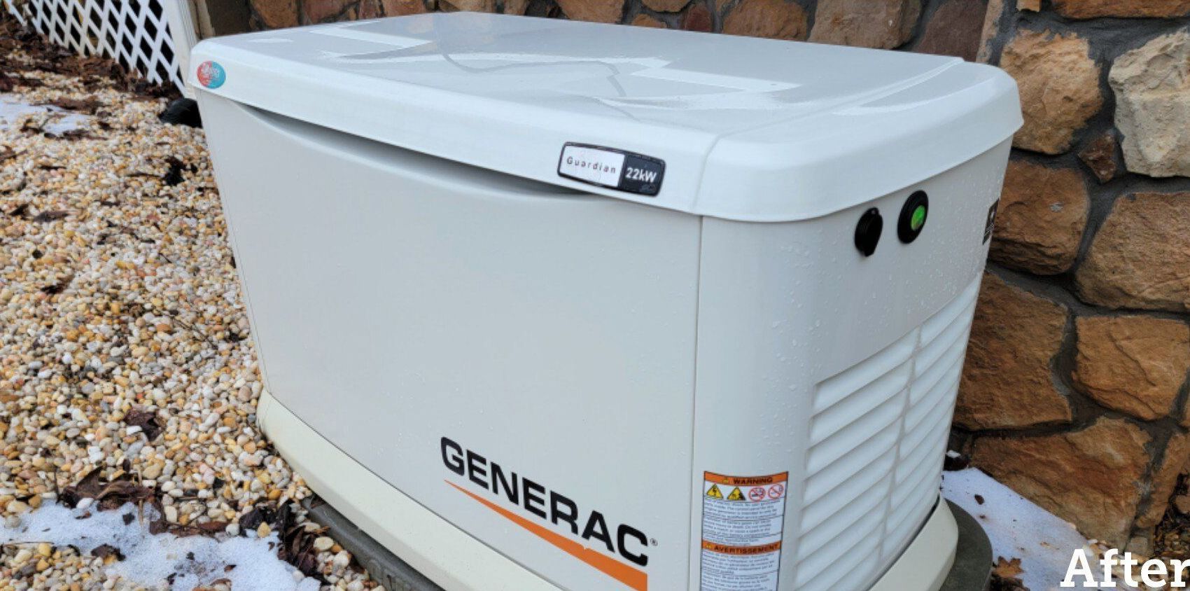 A Generac home standby generator in a gravel bed next to a stone wall.