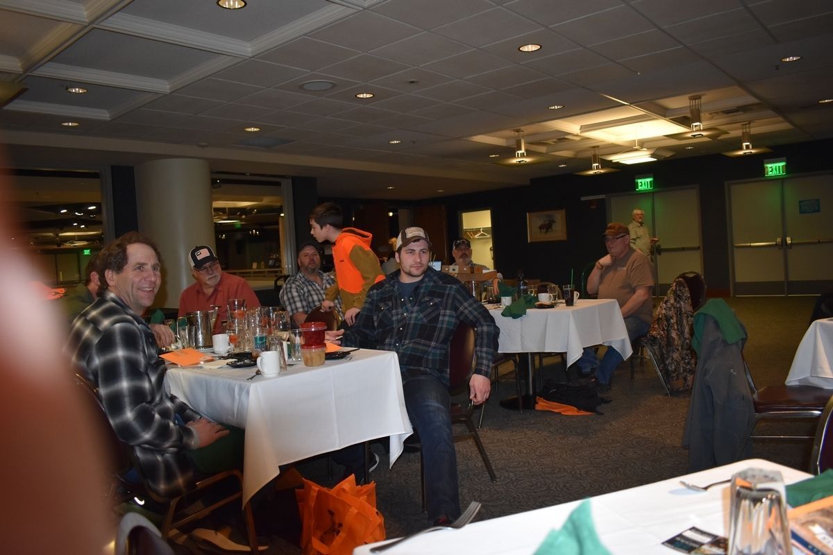 Guys On The Table Drinking — Tacoma, WA — Pheasants Forever