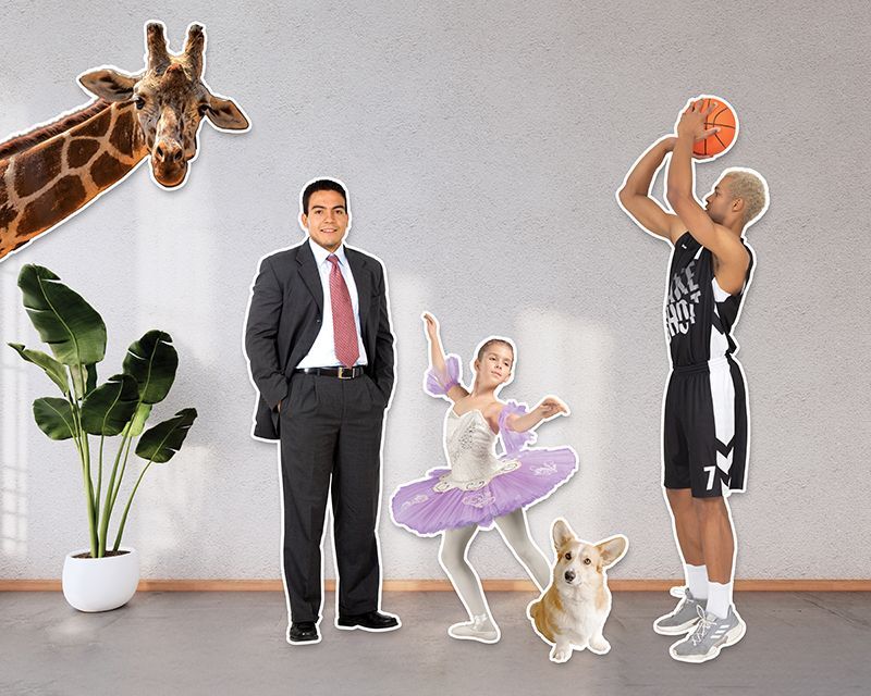 Life-size cutouts of man in suit, ballerina dancer, basketball player, pet Corgi, and giraffe