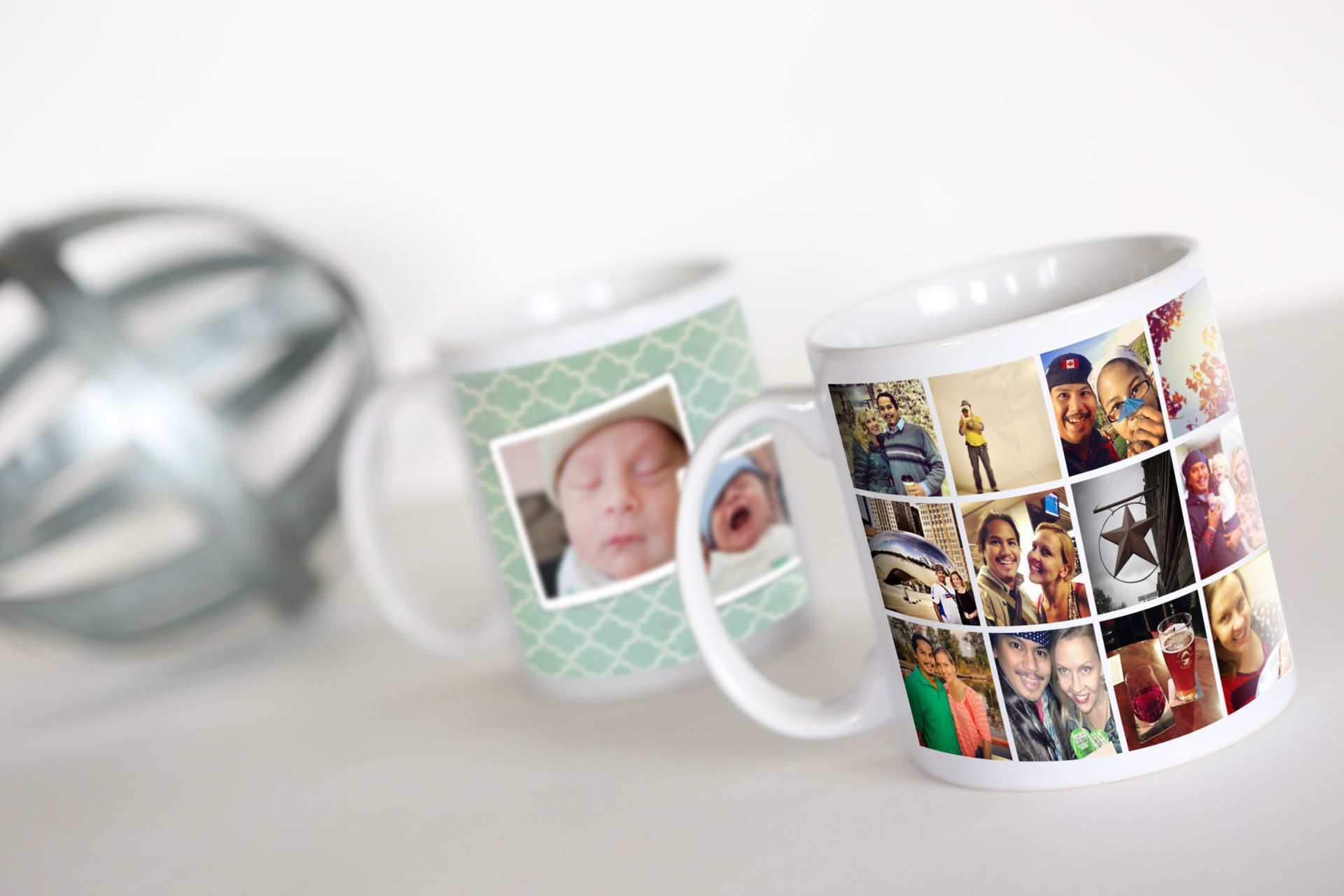 Two photo mugs sitting on table.
