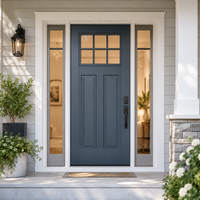 Blue front door with sidelights and a lantern on a modern house entryway