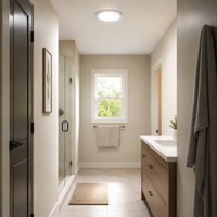 Modern bathroom with walk-in shower, vanity, window, and neutral decor