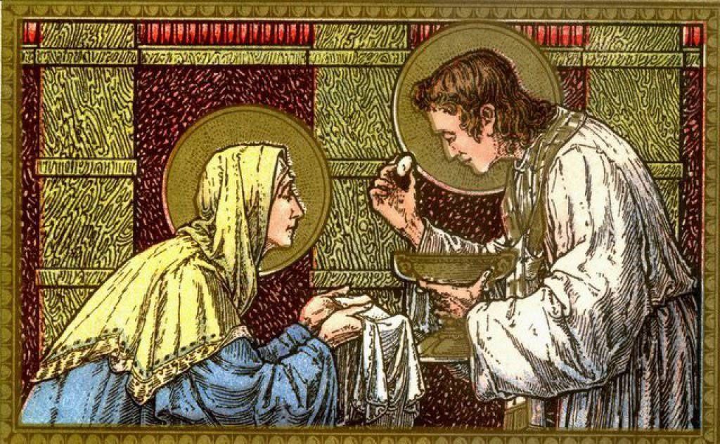Stained-glass scene of Jesus offering communion to a kneeling woman in a church